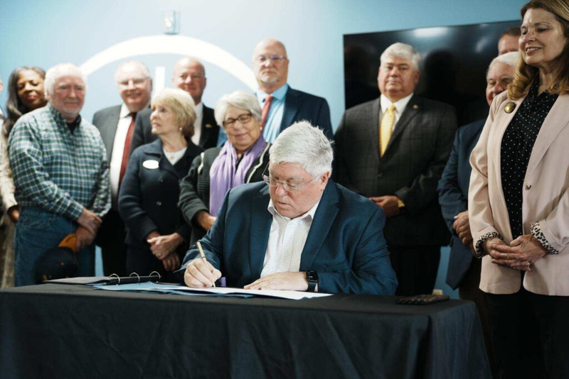 Morrisey celebrates signing of three bills at Beckley church