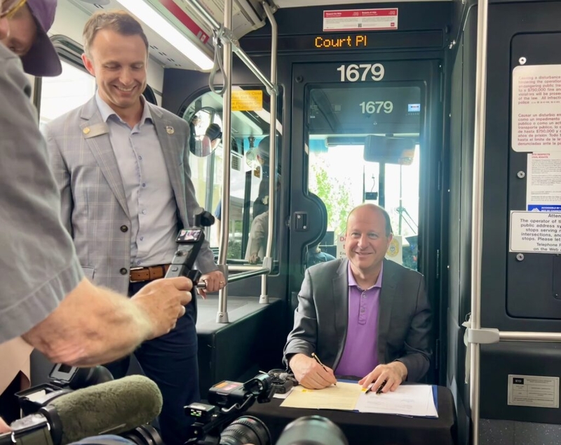​RTD board overhaul signed by Gov. Polis on a Denver bus