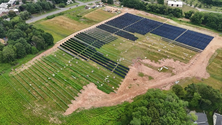 Projects like Verogy's community solar installation under construction in Glastonbury will lose the valuable 30% federal tax credit under the tax and spending legislation that became law on July 4. The law broadly will likely mean power prices will go up in Connecticut and around the country. Credit: Verogy