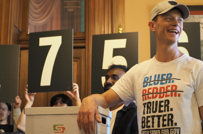Sand, Feenstra launch campaign ads as race rated ‘toss-up’ by political forecasters