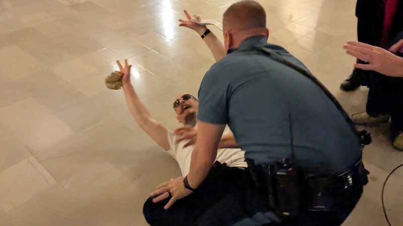 Loud, boisterous rival protests of religious freedom among Catholics and satanists turn violent