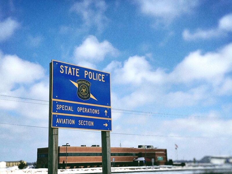 Complaint alleges Michigan police director and top deputy improperly received bonuses