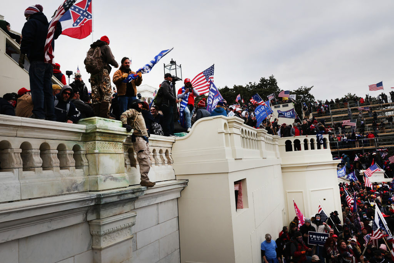 Thousands of Donald Trump supporters storm the United States Capitol building following a "Stop the Steal" rally on January 06, 2021 in Washington, DC. (Photo by Spencer Platt/Getty Images)