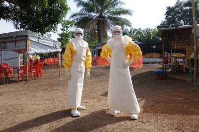 Fischer and a colleague suited up for full infection control during the 2014 West Africa Ebola outbreak.