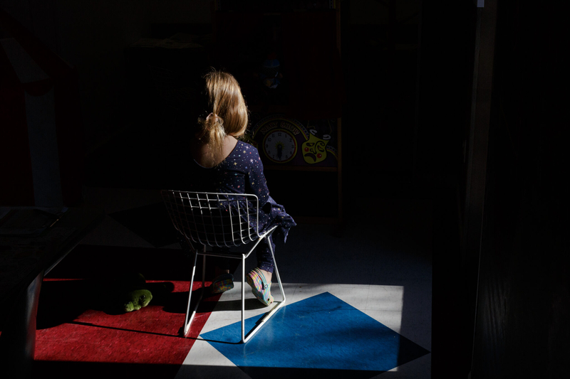 child seated in a chair