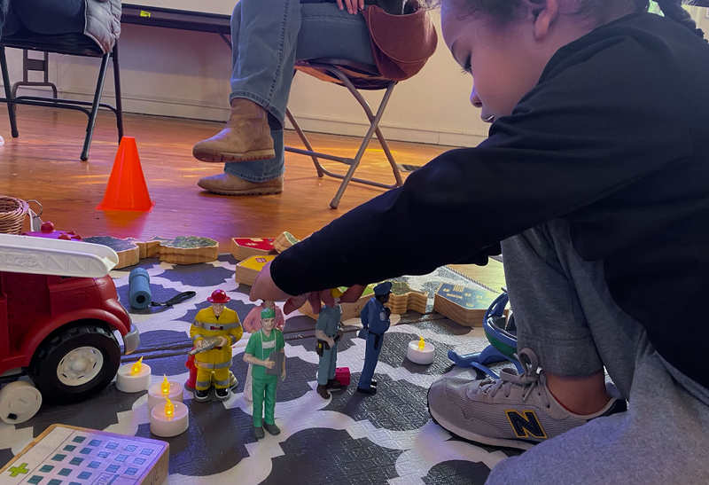 Fitz Lytle plays with action figures
