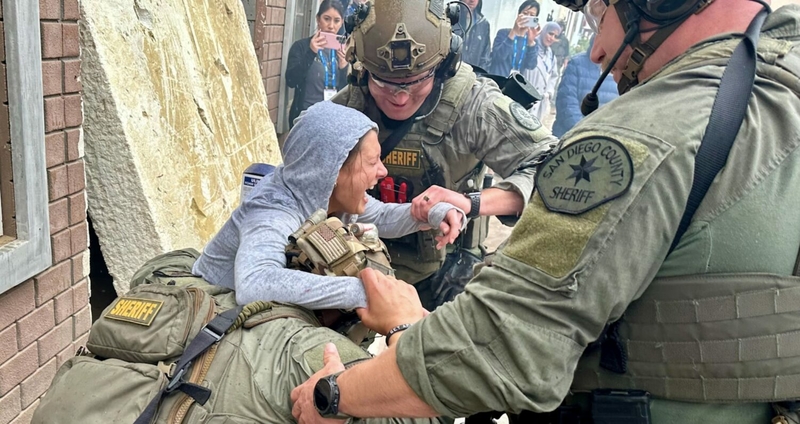 An actor is helped in a simulation training event.