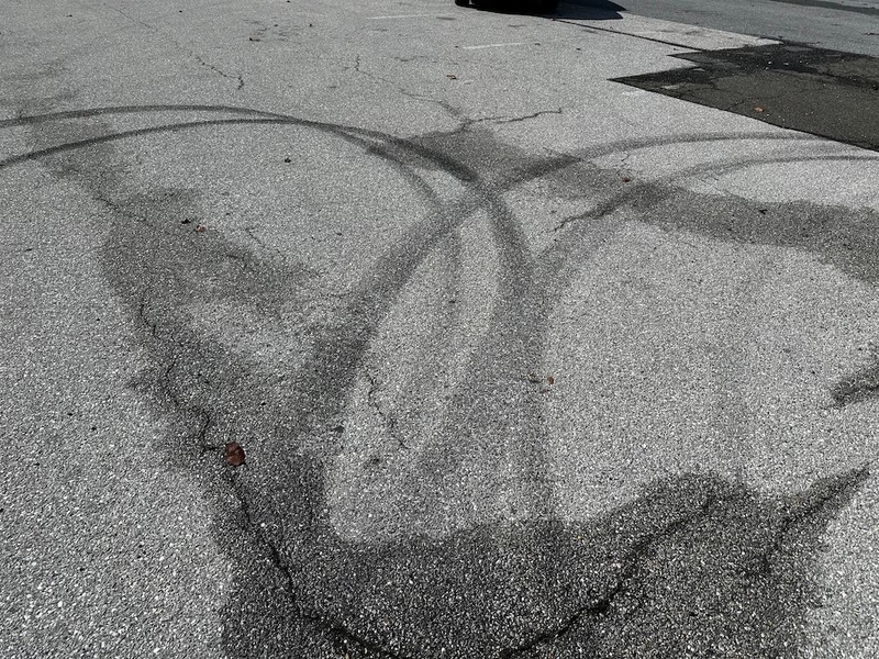 Tire marks remain from a car meetup.