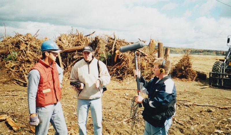 Tim Lambert, center, interviews Somerset County Coroner Wallace Miller, left. Former WITF News Director Damon Boughamer on the right records the conversation at the Flight 93 crash site on Oct. 6, 2001. (Courtesy of Tim Lambert)