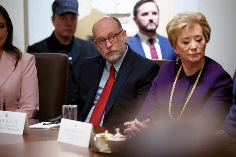 White House Office of Management and Budget Director Russell Vought (center), Education Secretary Linda McMahon (right) and White House adviser Elon Musk (back row, left) appear during a Cabinet meeting at the White House on February 26, 2025. (Photo by Andrew Harnik/Getty Images)