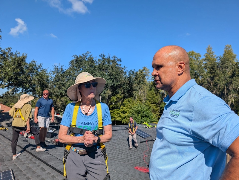 Gwen Graham spends a ‘workday’ helping to install solar panels