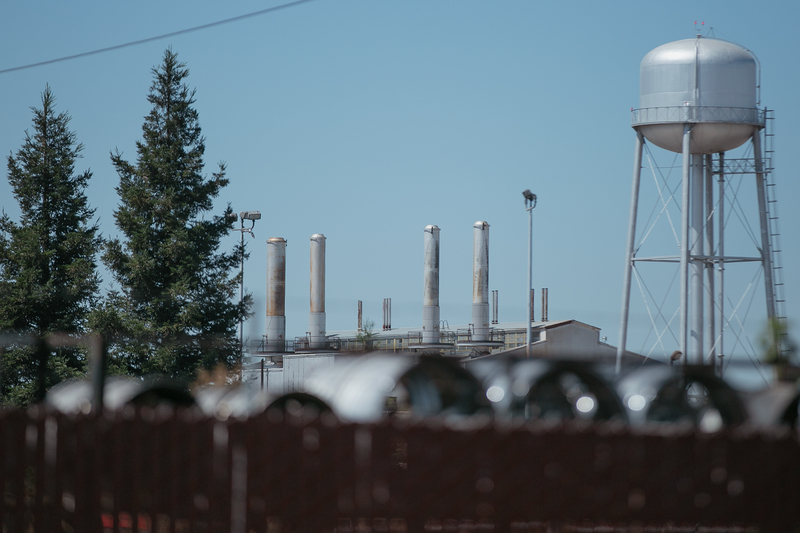 Gray cooling towers at a power plant.