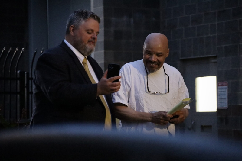 Attorney Neal Hamilton and Douglas Carter speak with another member of Carter's legal defense team after his release from the Utah County Jail in Spanish Fork on Monday, Sept. 28, 2026. (Annie Knox/Utah News Dispatch)