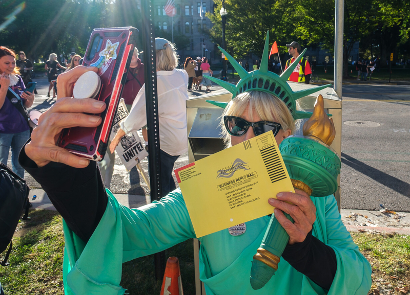 In Salt Lake City, No Kings marchers carry ballots to drop boxes