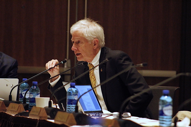 Seidel talks into a small microphone