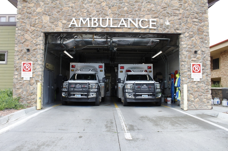 Two ambulances parked in a bay