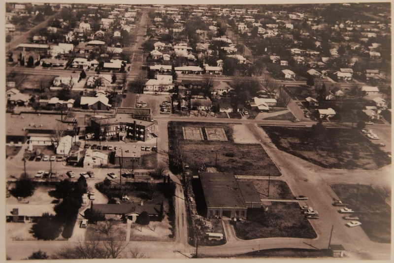 An archival birds-eye photo of the Olney-Hamilton Hospital (left).