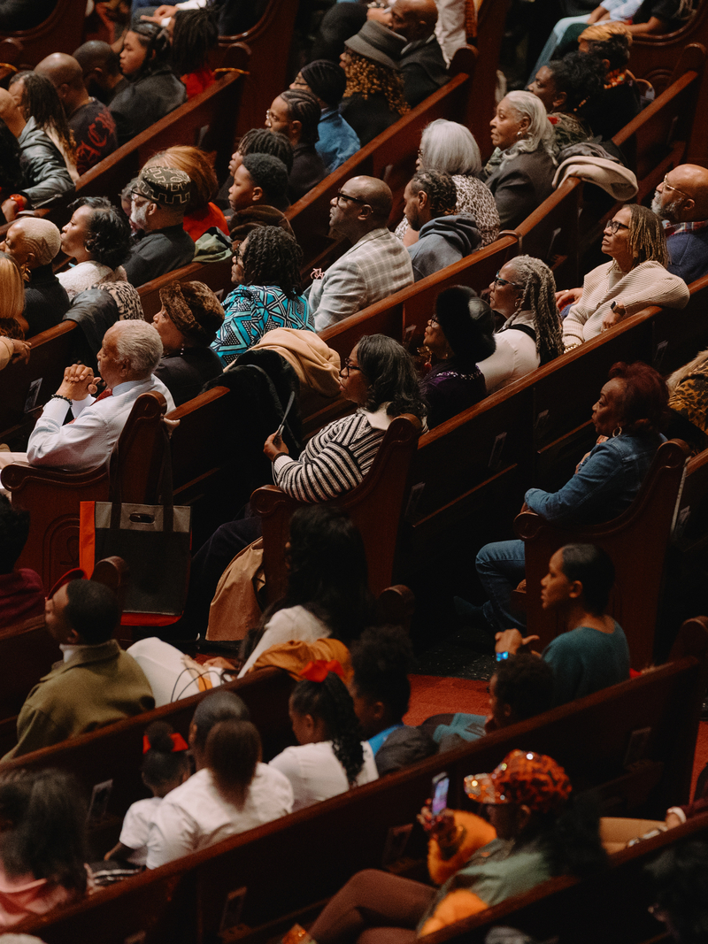 Churchgoers listen as Rev. Frederick D. Haynes III speaks during service.