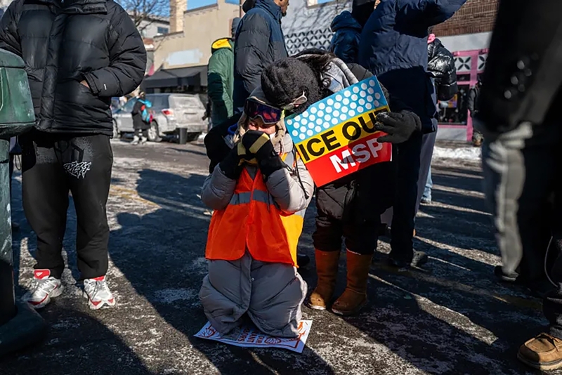 People gather at the location where Pretti was shot.