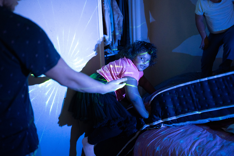 Seven-year-old Freyja Radtke, who suffers from Bardet-Biedl syndrome, a condition which causes excessive weight gain and hormonal imbalances, and in her particular case, an inability to control her own appetite, plays with her father, Sean Radtke, and sister Morrigan, 5, at the family’s home on Saturday, February 28, 2026 in El Paso, Texas. Because Freyja is due for a medical test next week, she is forced to be off of Imcivree, the medication that controls her hormonal imbalances that lead to excessive hu