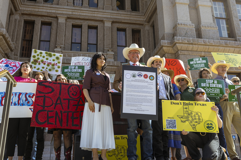 From left, at front and standing: Don’t Drain Texas organizer Maggie Hill, Agriculture Commissioner Sid Miller and Clayton Tucker, Democratic nominee for agriculture commissioner, join protesters on the Capitol steps in demand of a special session to regulate data center growth before a Senate Committee Hearing on Monday, July 27, 2026.