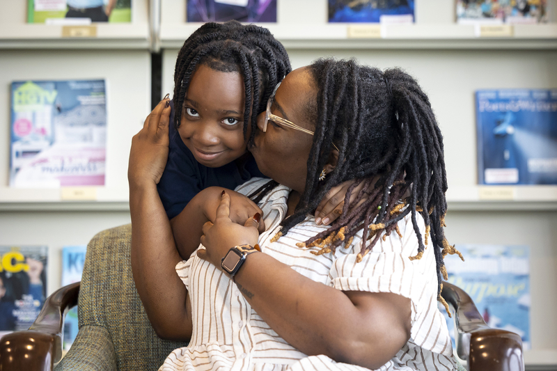 Jaleel Montgomery with his mom Mikole after a tutoring session at the Missouri City Branch Library.