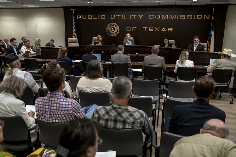 Commissioners of the Public Utility Commission of Texas listen to public comment during a special open meeting in Austin on Friday, August 14, 2026.