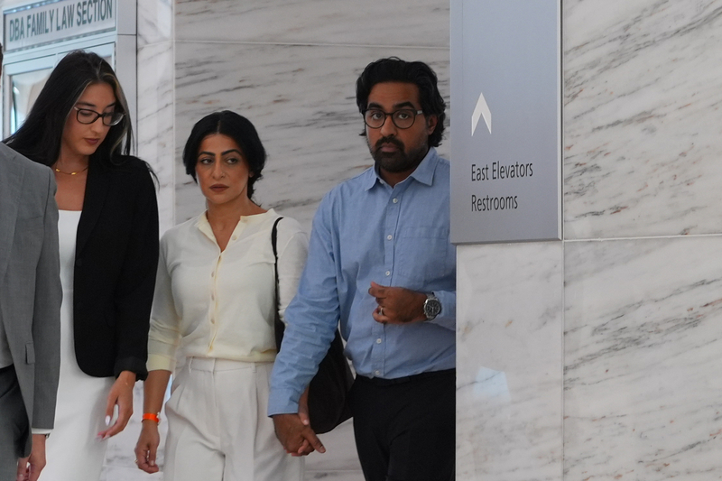 California couple confront their surrogate in a Texas court as dispute over newborn escalates