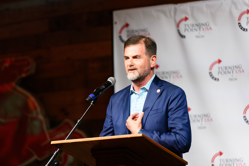 Texas Tech University System Chancellor Brandon Creighton speaks at a Turning Point USA rally at Cook's Garage in Lubbock on Oct. 7, 2025.
