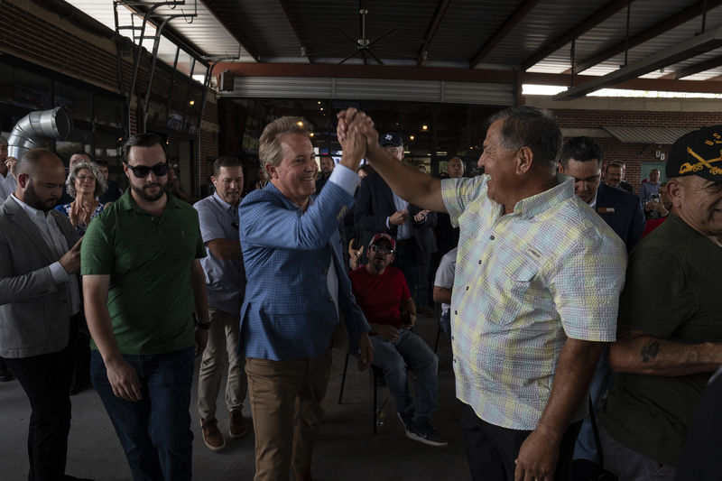 General Attorney Ken Paxton, Republican nominee for U.S. Senate, is greeted during a campaign rally in McAllen on July 14, 2026.