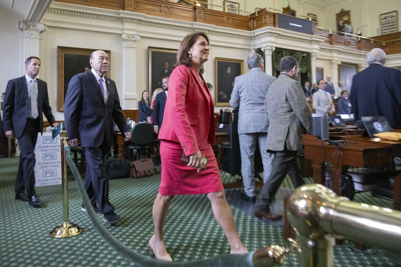 From left: Texas Sens. Nathan Johnson, D-Dallas, Juan "Chuy" Hinojosa, D-McAllen, and Angela Paxton, R-McKinney, walk onto the Senate floor at the beginning of day 5 of Texas Attorney General Ken Paxton’s impeachment trial at the Capitol in Austin on Monday, Sept. 11, 2023.