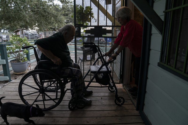 Eustorgia Santos de Torres, 67, right, helps her husband, Nemorio Torres, 79, get in their home in Alamo on Oct. 18, 2026. Her husband is blind and requires her assistance.
