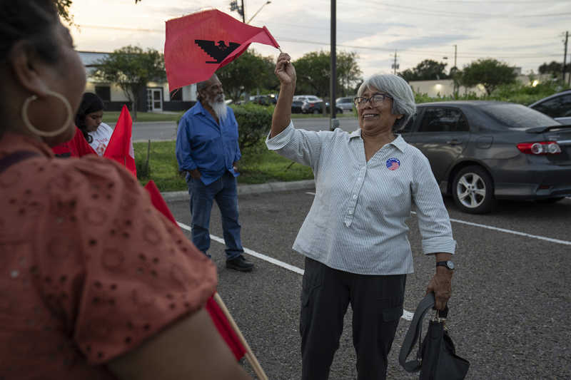As La Unión del Pueblo Entero members cheer her on, Eustorgia celebrates after voting outside a polling location in Alamo on Oct. 19.