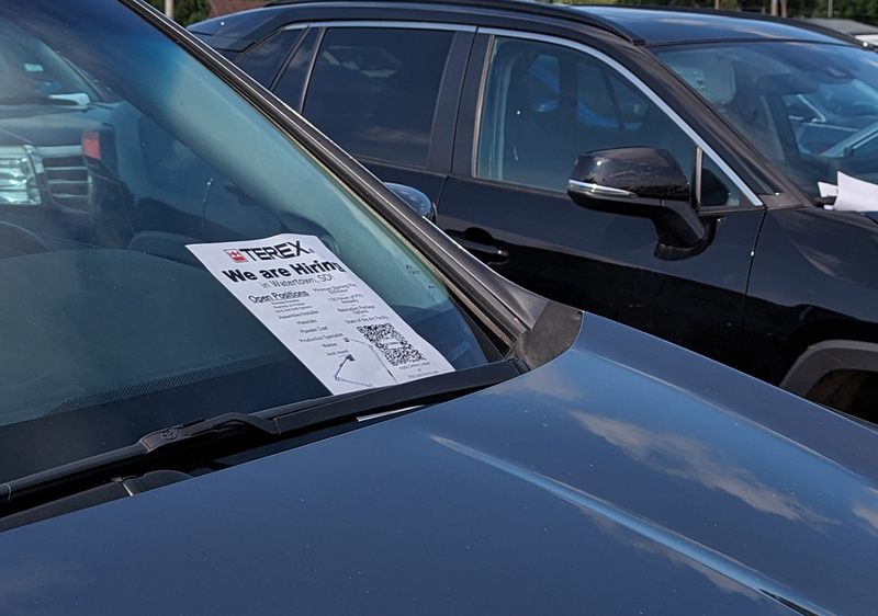 A flyer on a vehicle announcing job openings, as seen in the parking lot of the Huron Soccer Complex. The complex was hosting a soccer tournament for the Karen ethnic group. (John Hult/South Dakota Searchlight)