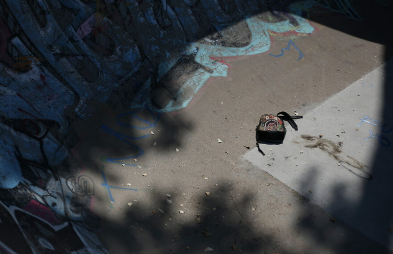 A discarded backpack lays at the bottom of the Pine Ridge skatepark bowl on Wednesday, Aug. 23, 2023. (Makenzie Huber, South Dakota Searchlight)