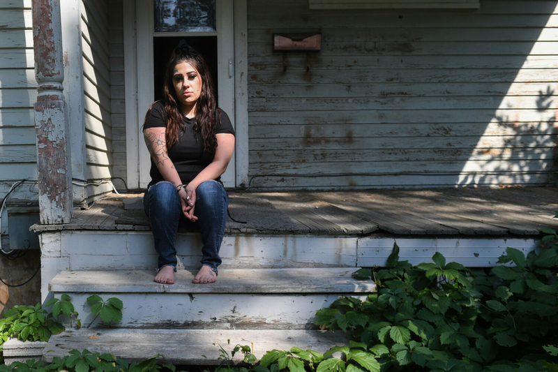 Christian Banley sits on the front patio of her Aberdeen home on Aug. 23, 2023. (Samantha Laurey/Argus Leader)