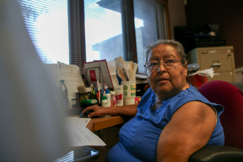Juanita Scherich, ICWA supervisor for the Oglala Sioux Tribe, responds to emails in her office in Pine Ridge on Aug. 23, 2023. (Makenzie Huber/South Dakota Searchlight)
