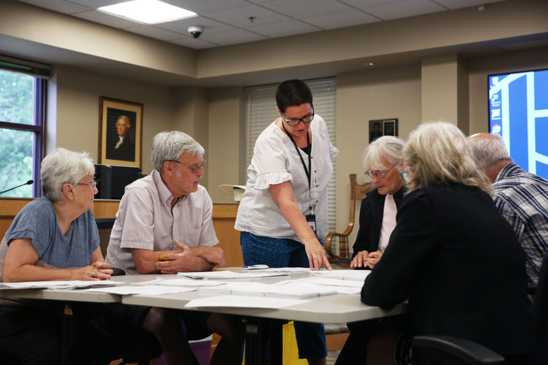 Lincoln County Auditor Sheri Lund oversees election workers conducting the county's first-ever post-election audit on June 20, 2024. (Makenzie Huber/South Dakota Searchlight)
