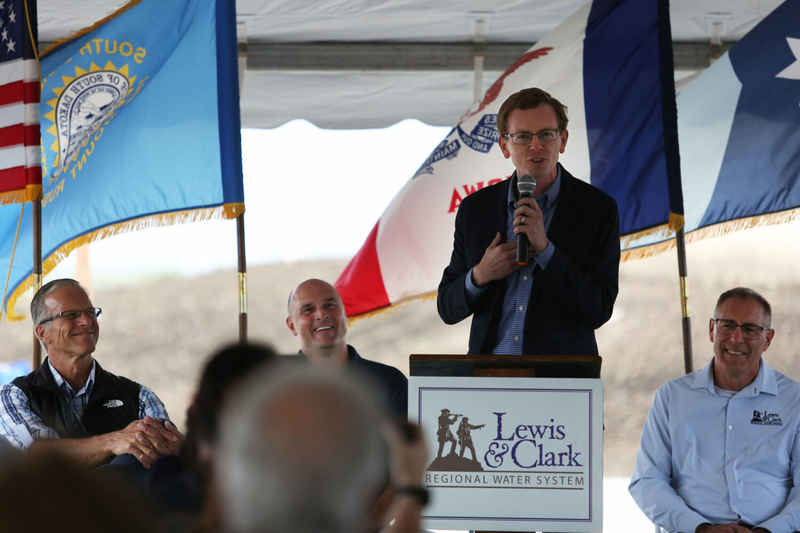 South Dakota Rep. Dusty Johnson speaks at Madison's Lewis and Clark Regional Water System ribbon cutting on Aug. 21, 2024. (Makenzie Huber/South Dakota Searchlight)