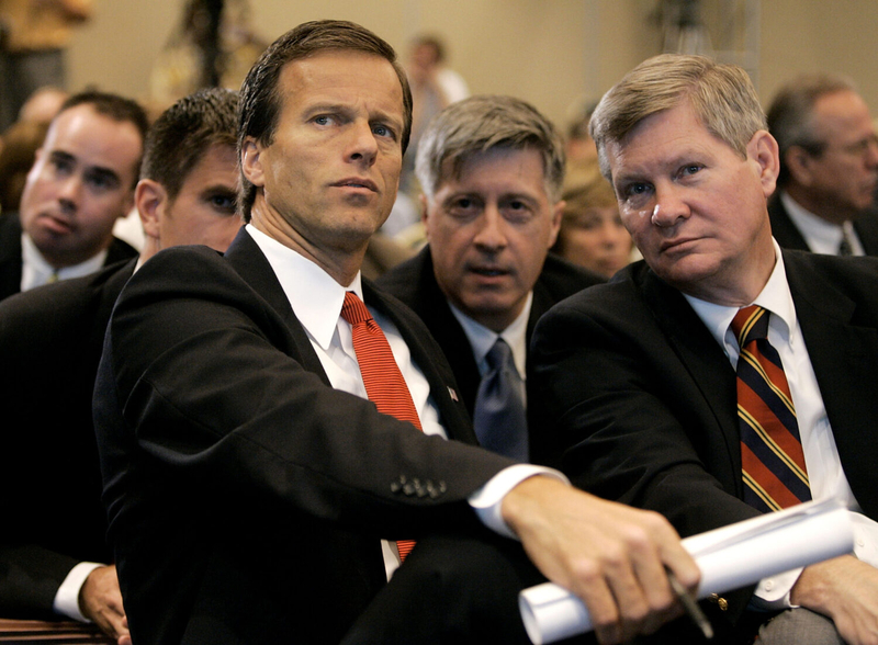 Republican U.S. Sen. John Thune, left, and Democratic U.S. Sen. Tim Johnson, both of South Dakota, watch as the Base Closure and Realignment Commission votes to save South Dakota's Ellsworth Air Force Base on Aug. 26, 2005, in Arlington, Virginia. (Mark Wilson/Getty Images)