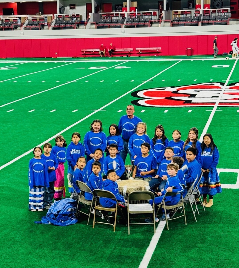 The Black Pipe Singers take a picture at the University of South Dakota DakotaDome. The group has performed at several occassions, including at the state Capitol building. (Courtesy of Brian Brown)