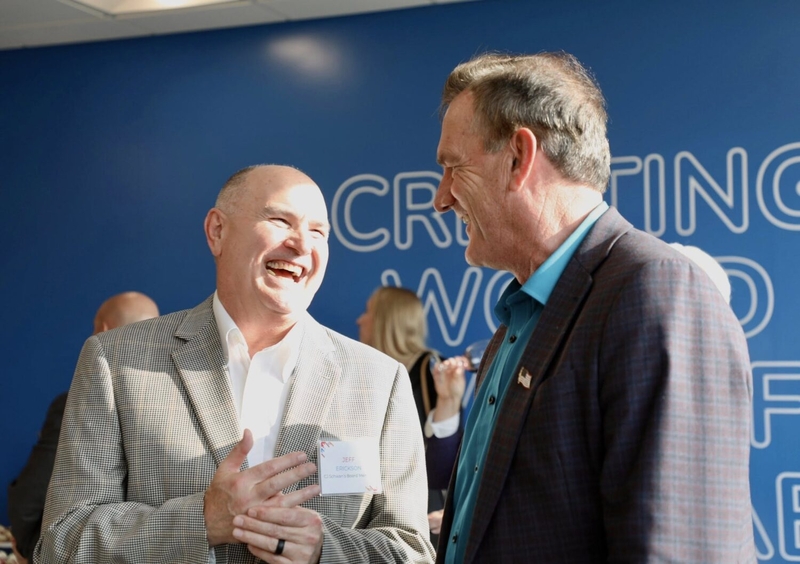 Jeff Erickson, left, a member of the corporate board of CJ Schwan's and the chairman of the South Dakota Board of Economic Development, speaks with Gov. Larry Rhoden in September 2025 during the opening of a CJ Schwan's office in downtown Sioux Falls, South Dakota. (Photo by Governor's Office)