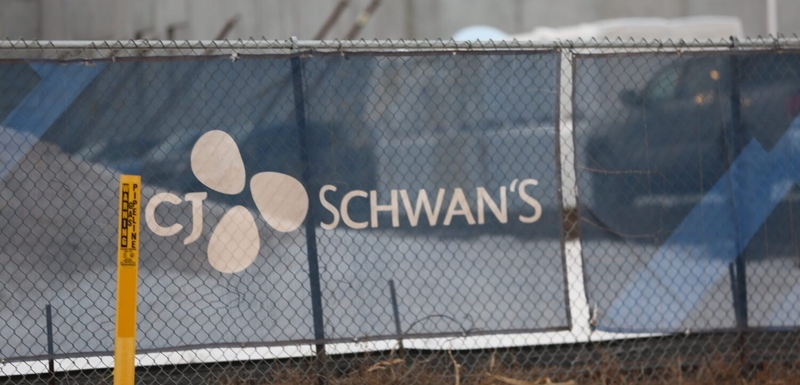 Signage identifies the site where a CJ Schwan's food production plant is under construction on Dec. 12, 2025, in Sioux Falls, South Dakota. (Photo By Joshua Haiar/South Dakota Searchlight)