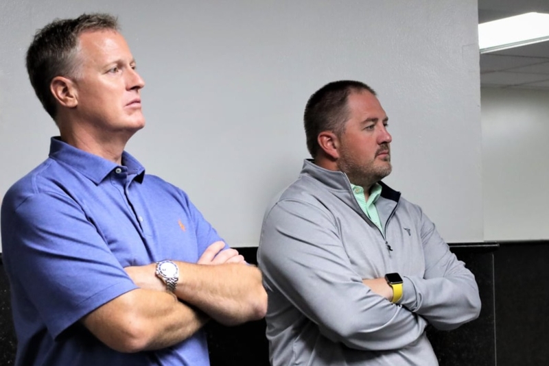 Steve Westra, left, commissioner of the Governor's Office of Economic Development, and Deputy Commissioner Chris Schilken tour an Agropur cheese plant in 2021 in Lake Norden, South Dakota. (Photo by Governor's Office of Economic Development)