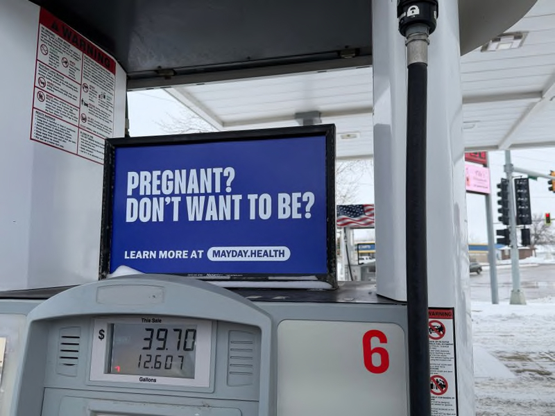 Mayday Health posted signs like this one at gas stations around South Dakota in December 2025 as part of a campaign to spread awareness about the availability of abortion pills. (Courtesy of Mayday Health)