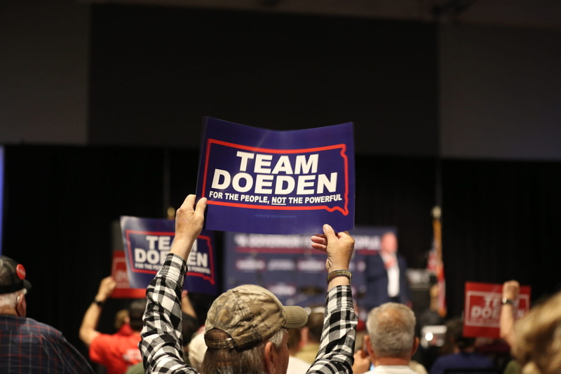 Supporters of Toby Doeden's campaign for governor cheer as he gives a speech in Sioux Falls during the early morning hours of June 3, 2026. (Photo by Joshua Haiar/South Dakota Searchlight)
