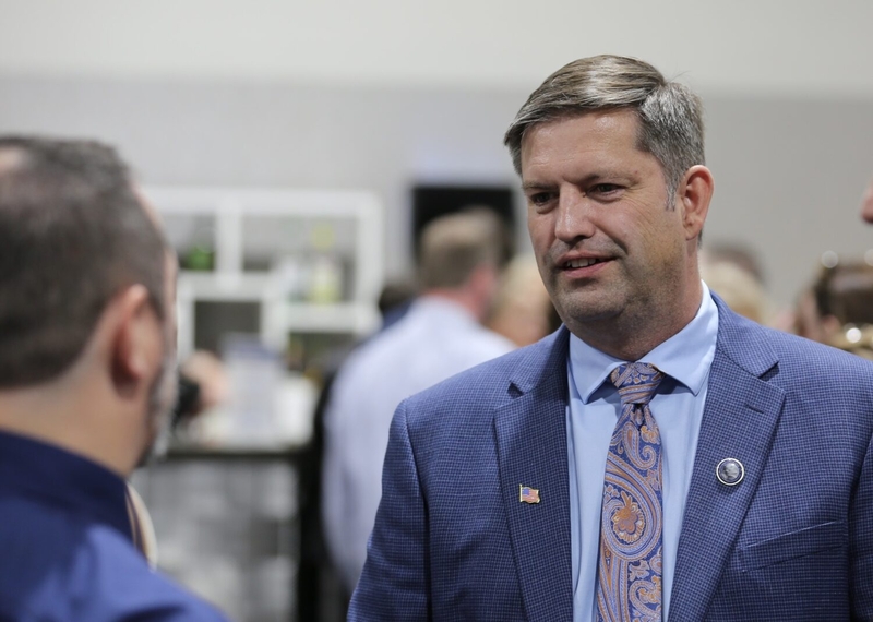 Democratic candidate for governor, Dan Ahlers, talks with Democratic voters during the 2026 McGovern Day Dinner in Sioux Falls on June 5, 2026. (Photo by Joshua Haiar/South Dakota Searchlight)