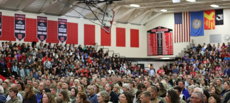 Wagner, South Dakota’s community school gymnasium is full of people on Oct. 22, 2026, for a ceremony honoring about 120 South Dakota National Guard soldiers preparing to deploy to the U.S.-Mexico border for a year.