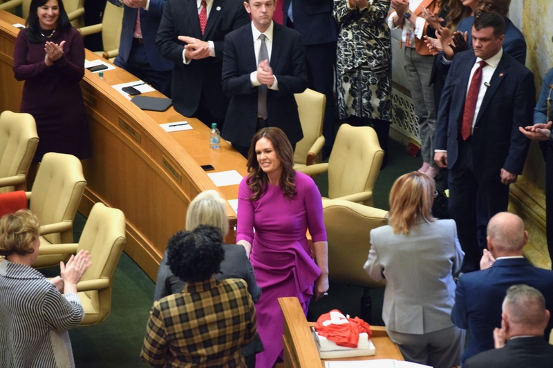Gov. Sarah Huckabee Sanders shakes hands with Arkansas lawmakers
