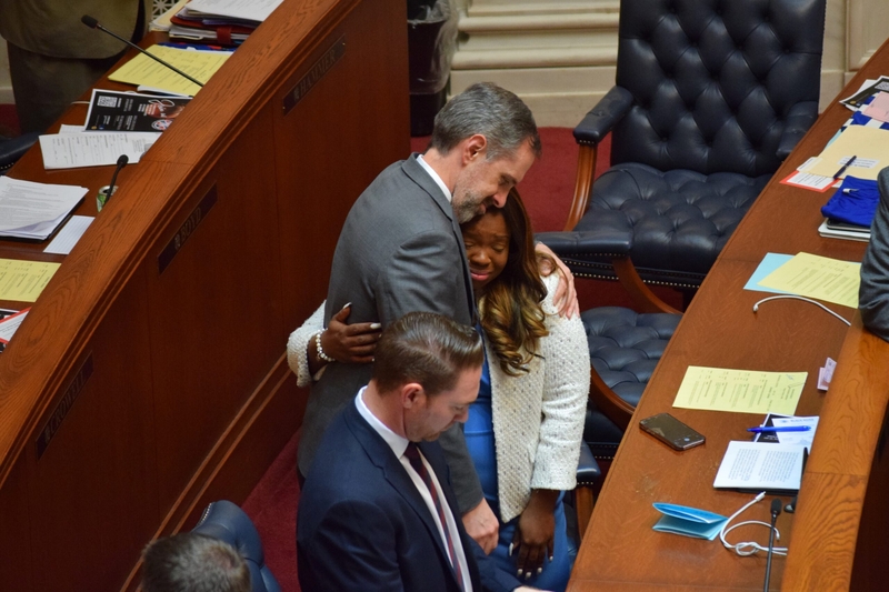 Fayetteville Democratic Sen. Greg Leding hugs Sen. Jamie Scott